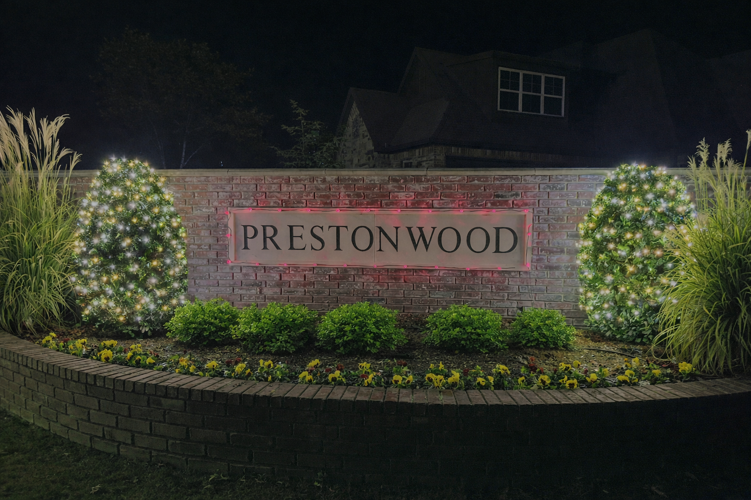 Prestonwood entrance decorated with Christmas lights at night
