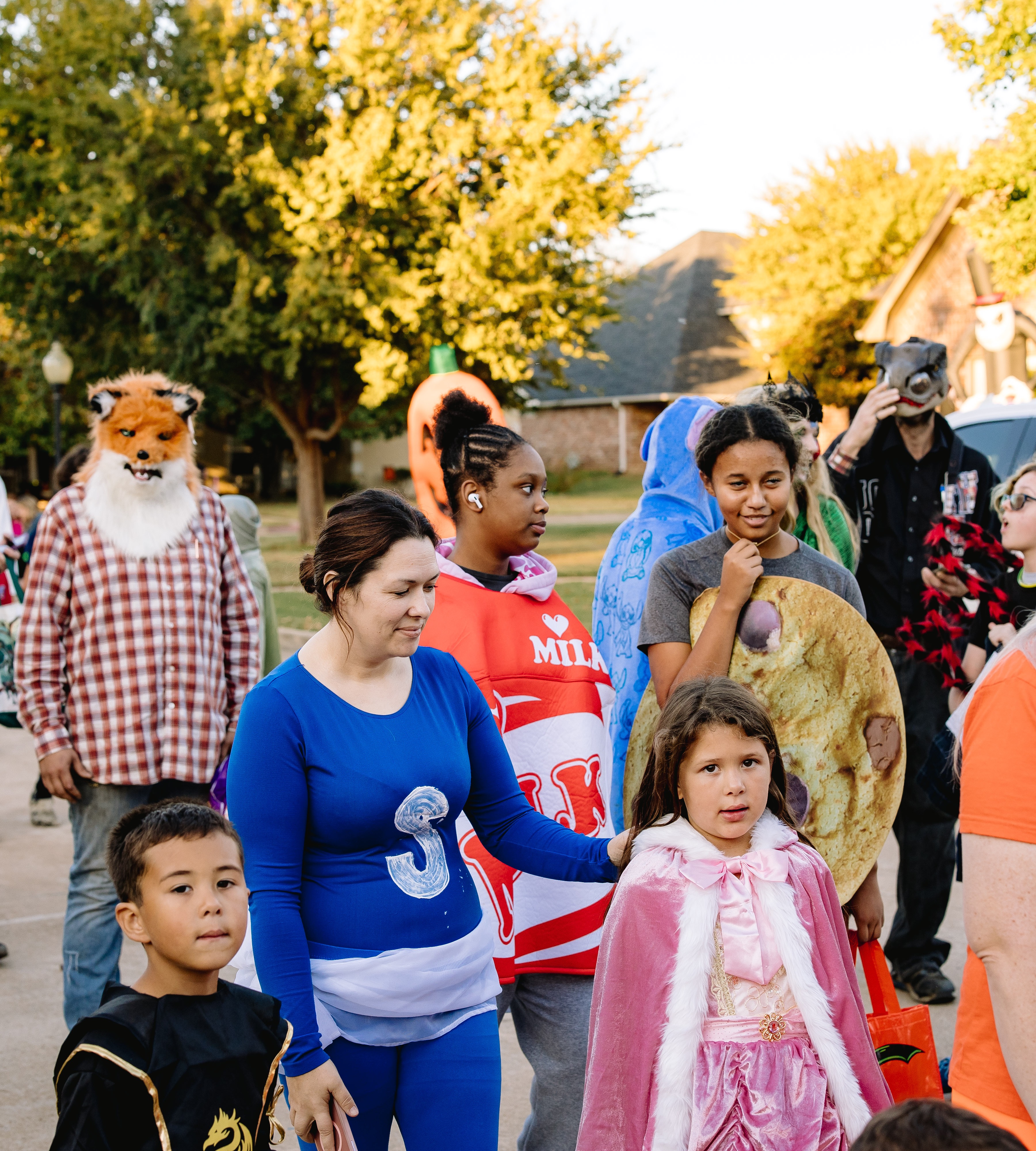 Crowd walking through Prestonwood on Halloween night