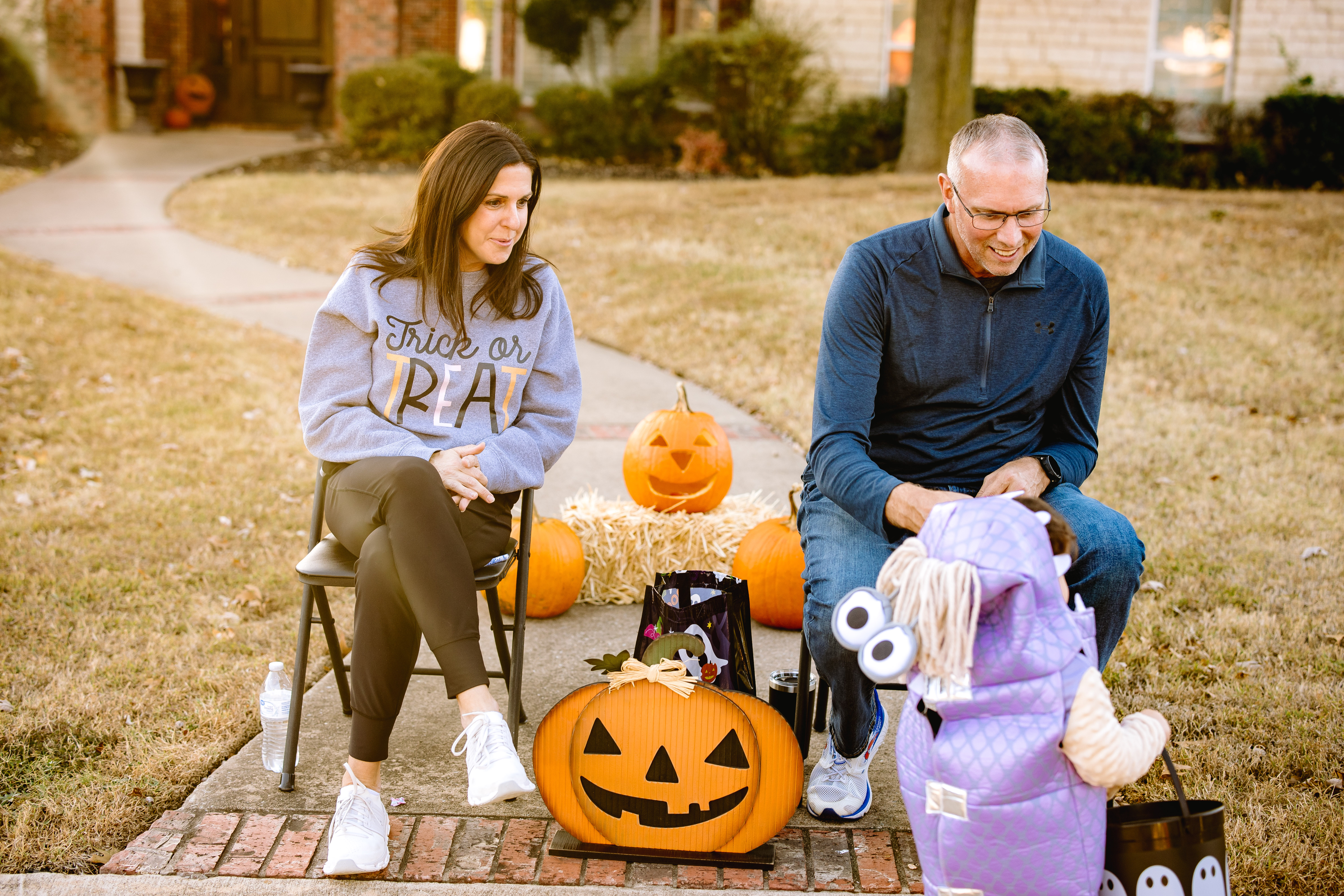 Neighbors handing out candy at the Prestonwood Halloween Walk